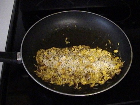 Add some eggs, scramble, melted grated cheese